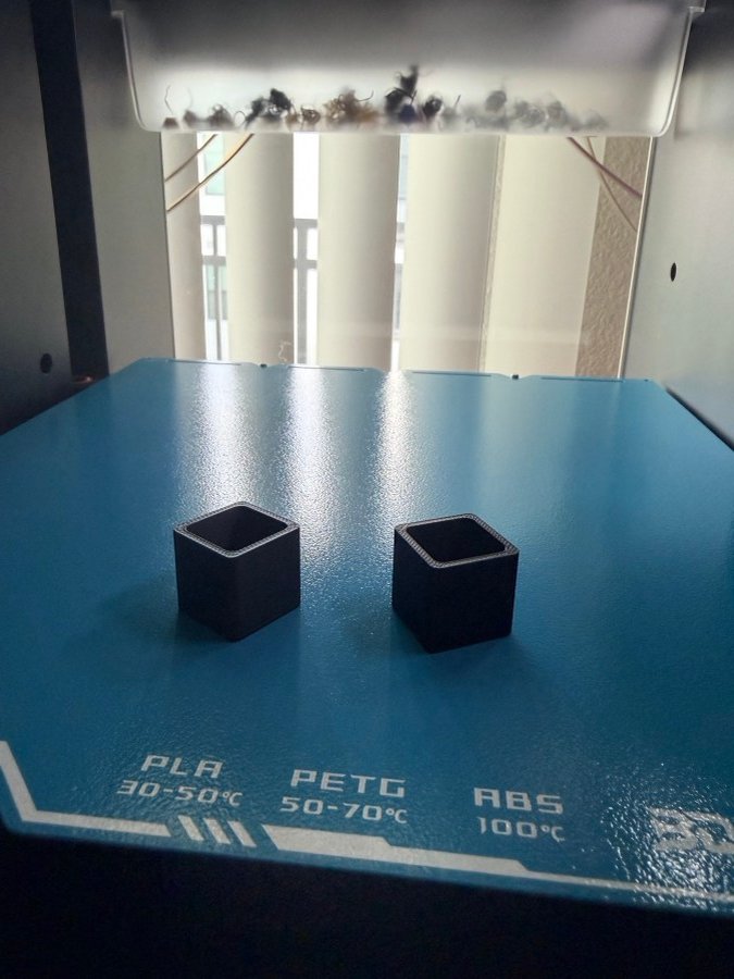 PLA, PETG, and ABS material test prints side by side