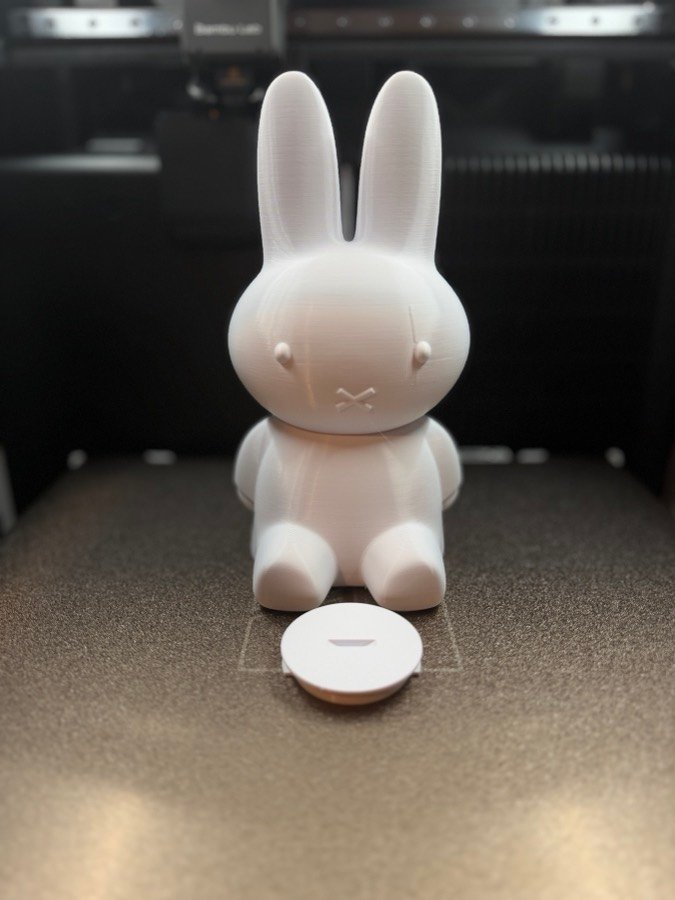 A rabbit figure being 3D printed